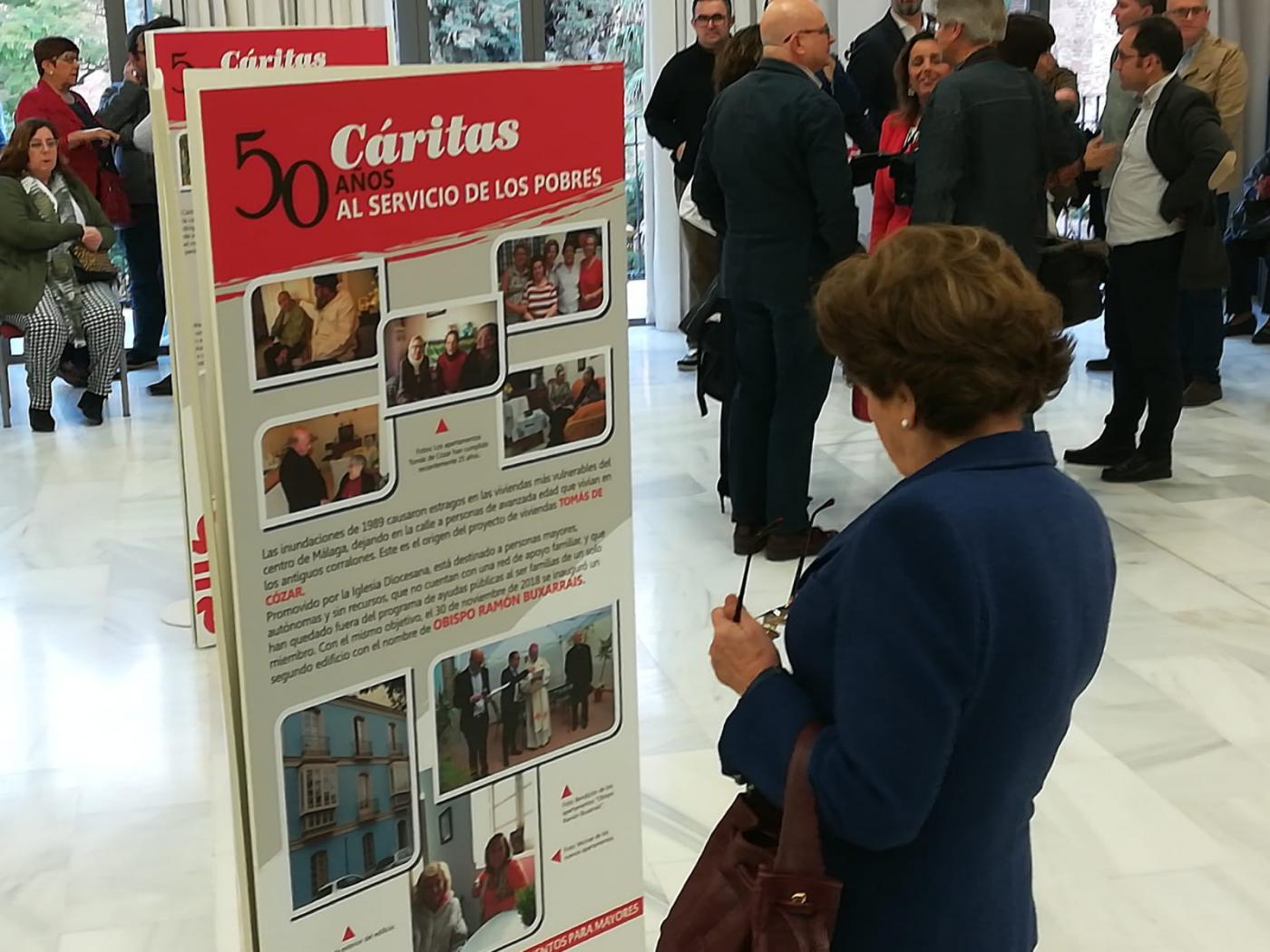 Inauguración de la exposición de Cáritas por su 50 aniversario en la casa hermandad de Estudiantes// CÁRITAS MÁLAGA